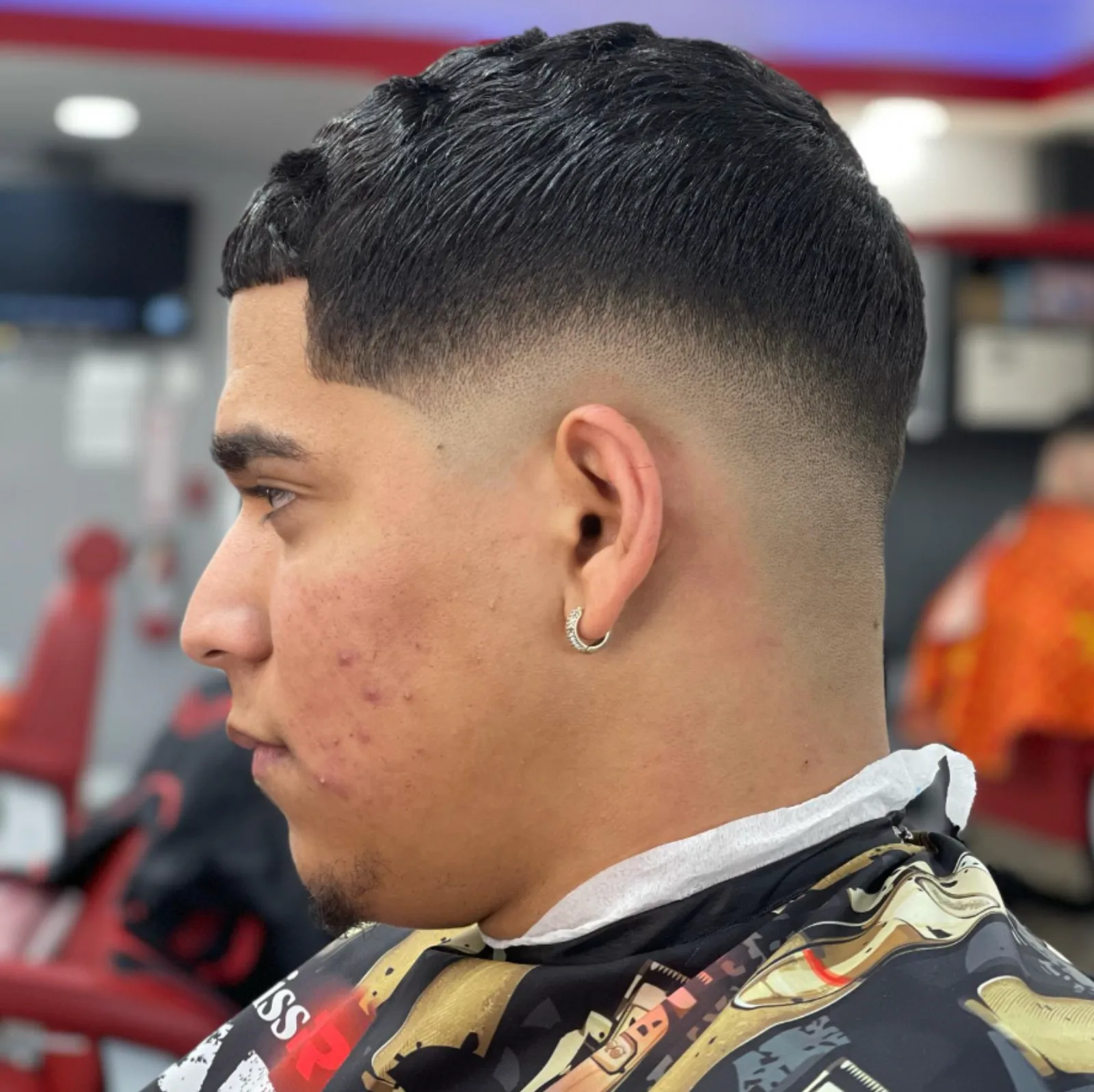 Crew cut with a clean bald fade and shape-up
