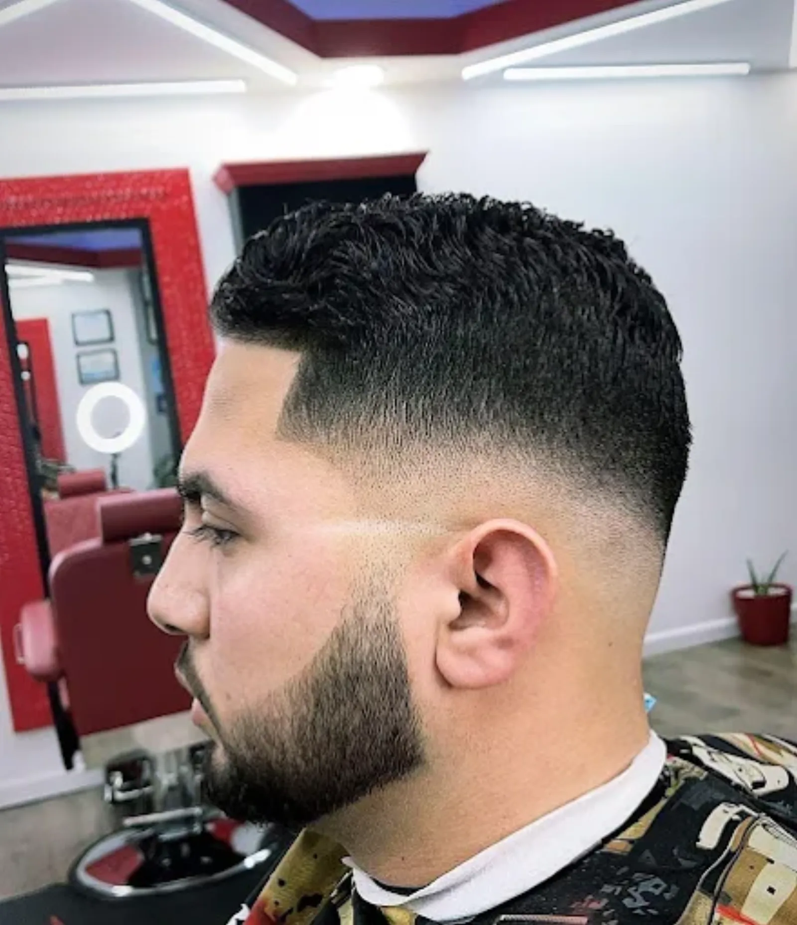Crew cut paired with a precise beard sculpt and line-up